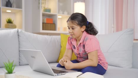 Girl-child-chatting-on-laptop.
